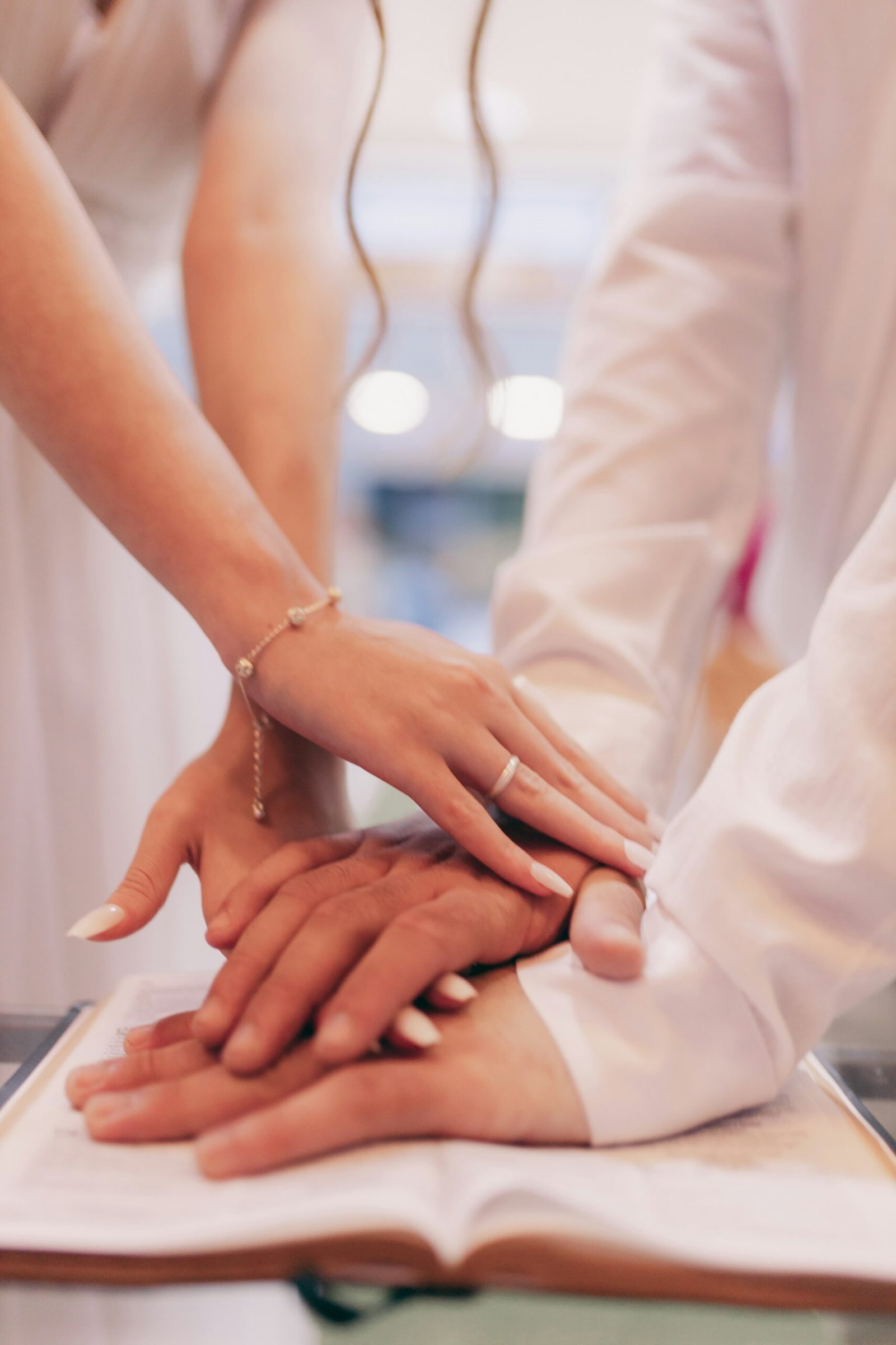 Clinician holding a patient’s hands